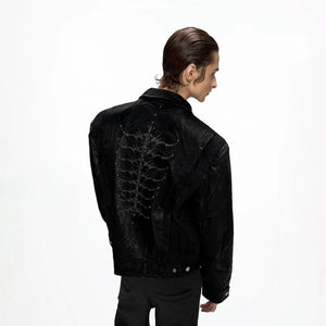Front view of black snake eye studded spine faux leather jacket