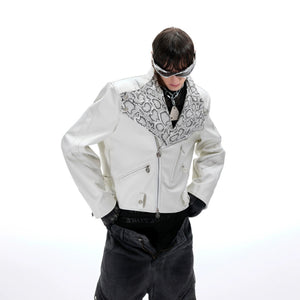 Model wearing cropped snake skin moto jacket in urban street setting
