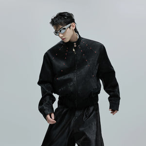 Close up of red faux leather jacket with python texture