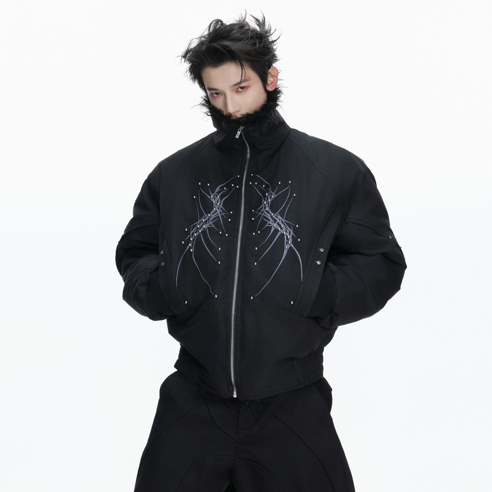 Front view of heavyweight boxy padded jacket with embroidery details