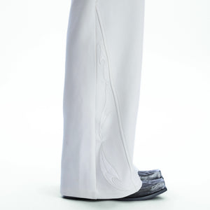 Rear view of baggy deconstructed trousers highlighting the A-line silhouette