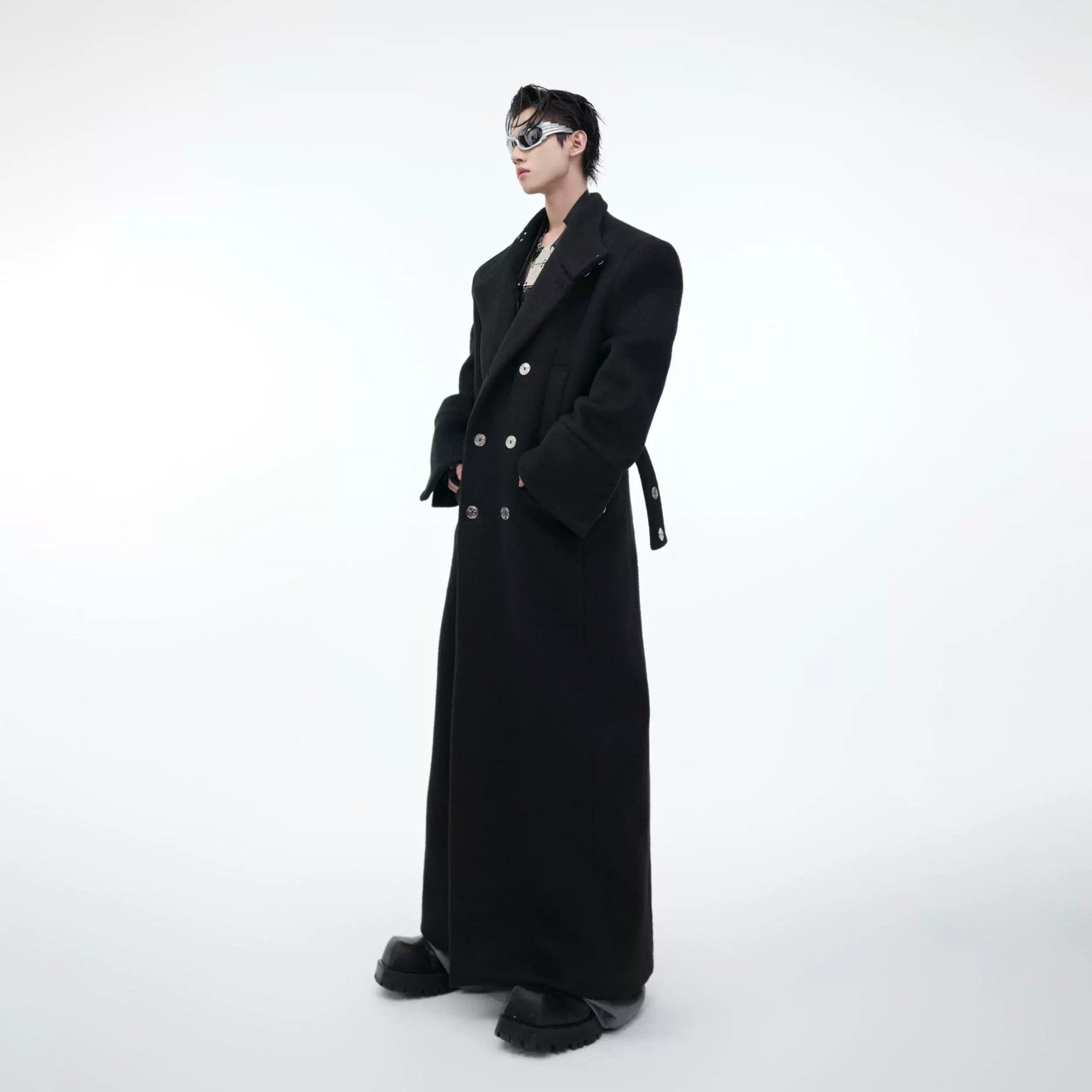 Men's long black wool coat with industrial metal buckles and stand collar