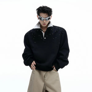 Oversized black polo sweatshirt with pearl and sequin starry details front view
