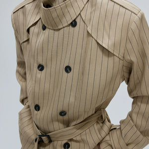 Full set of white deconstructed trench coat and matching wide-leg pants.