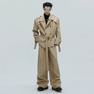 Model wearing the oversized padded shoulder trench coat in a street setting.