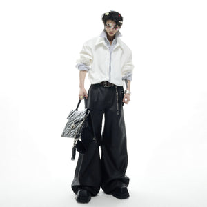 Model wearing a pink fake two-piece shirt paired with baggy jeans.