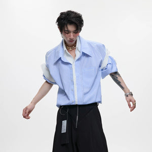 Front view of a men's blue striped faux two-piece short sleeve shirt in a loose fit.