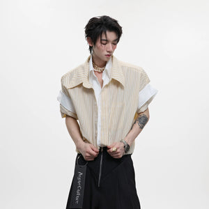 Model wearing a yellow striped oversized preppy shirt with a contrast white collar.