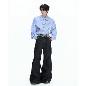 Back view showing the structured shoulder silhouette of the striped shirt.