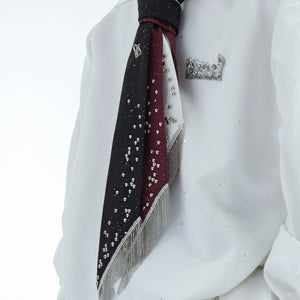 Model wearing a red studded fringe tie with a designer blazer.