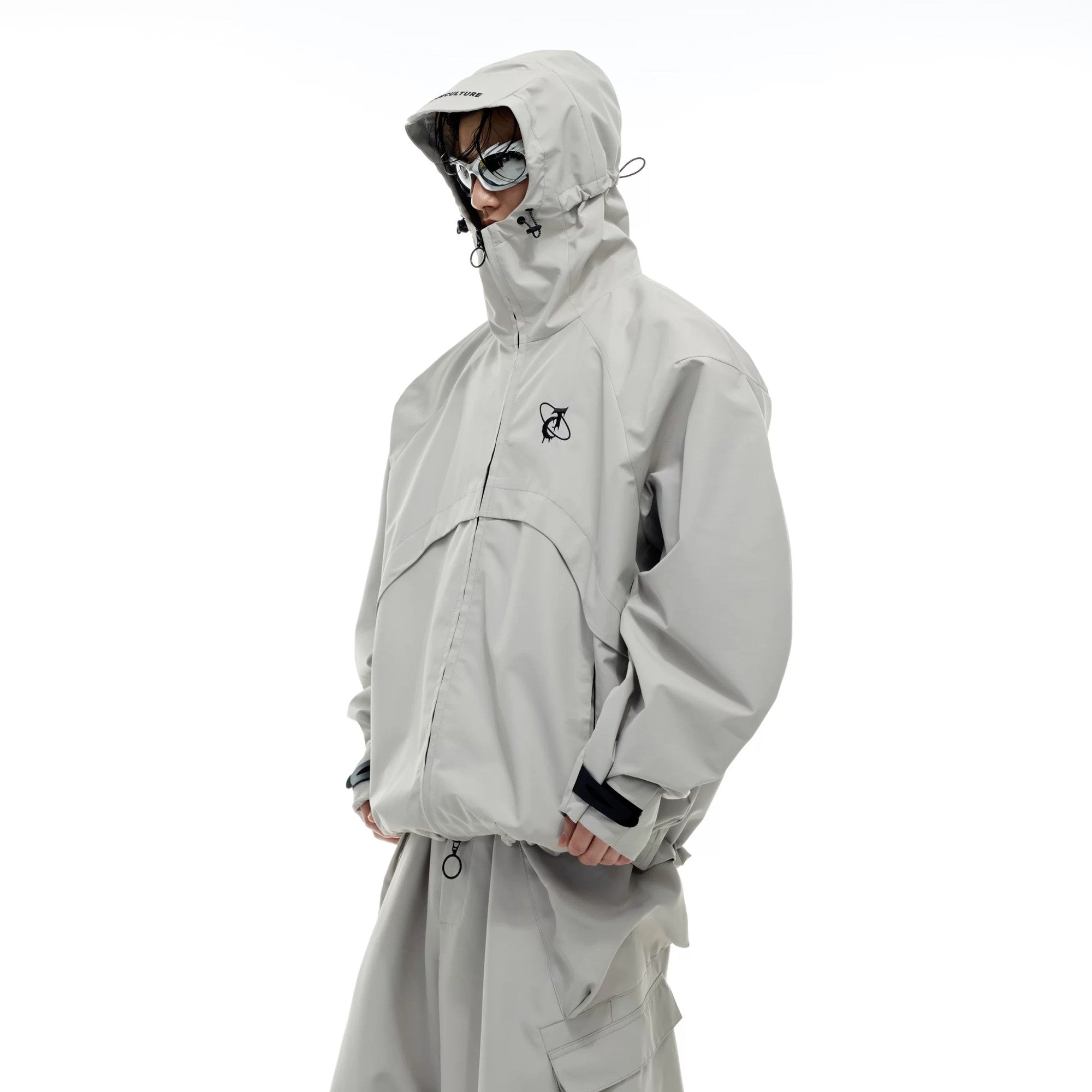 Front view of the techwear waterproof hiking jacket and pants set in black