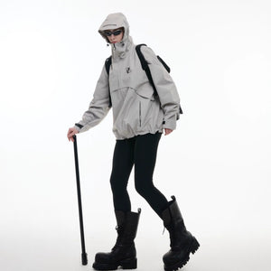 Demonstration of the waterproof and windproof capabilities of the gorpcore set