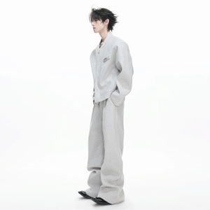 Full front view of the textured wool blend zip-up hoodie and wide-leg pants set in dark gray.