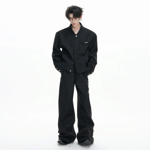 Close-up of the irregular collar and matte metal zipper details on the wool-blend top.