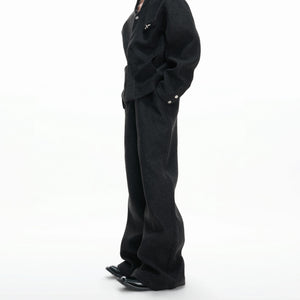 Model wearing the relaxed wide-leg wool blend pants with side slant pockets.