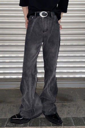 Close-up of distressed hem and tie-dye denim texture