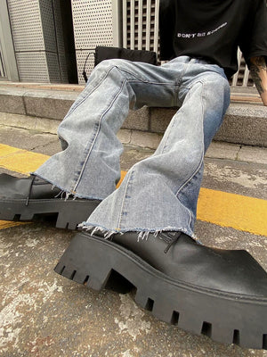 Model wearing tie-dye flared jeans with chunky sneakers