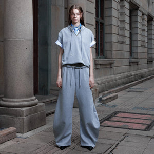 Front view of the luxury V-neck houndstooth streetwear set in apricot