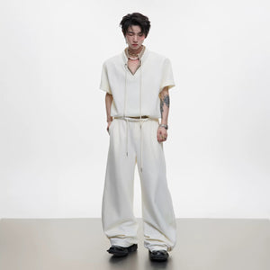 Model wearing apricot houndstooth short sleeve set with curved pants