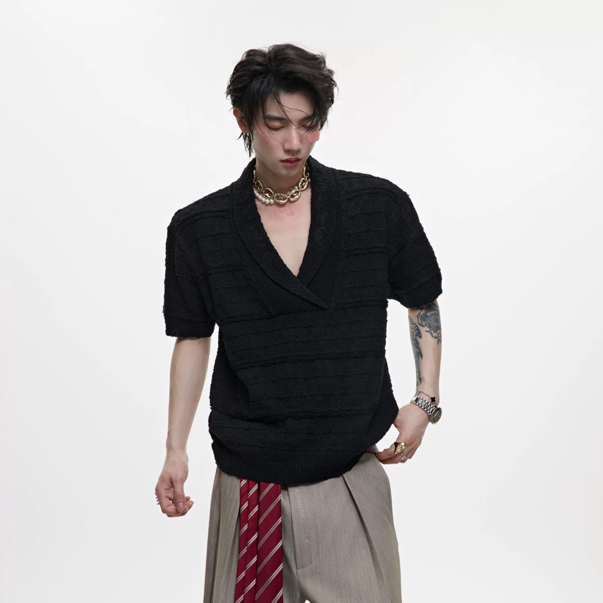 Front view of black V-neck short sleeve knit shirt for men
