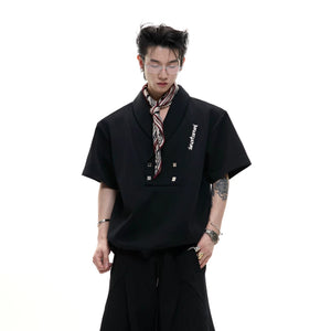 Close up of metal branding and buckle details on a streetwear tee