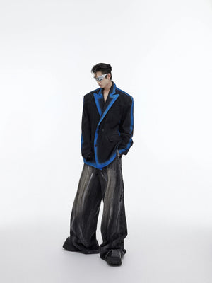 Model wearing blue gradient denim blazer in a streetwear setting