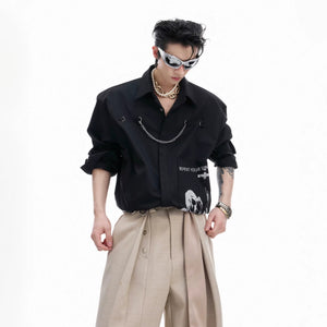 Close-up of industrial metal chain and patchwork fabric texture