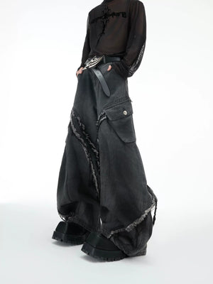 Front view of vintage black curved silhouette baggy jeans with raw edges