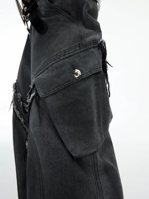 Close up of raw edge hem and distressed fabric on black denim pants