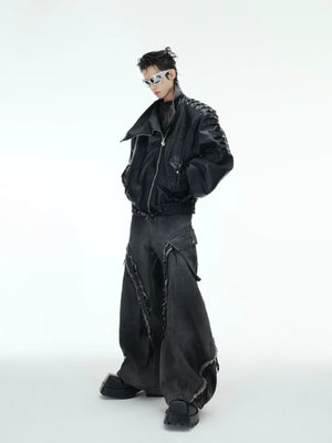 Flat lay of deconstructed black jeans with metal accents and 3D cut