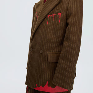 Back view of the striped wool blazer showing double vent design