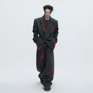 Matching brown striped wool pants in a loose streetwear fit