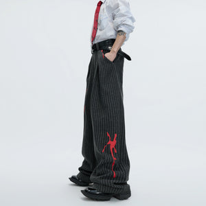 Model wearing full gray deconstructed striped wool suit