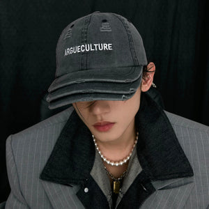 Close up of frayed edges and destroyed cotton denim material