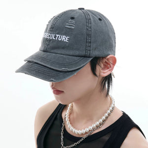 Side profile of a unisex vintage sun hat with curved brim