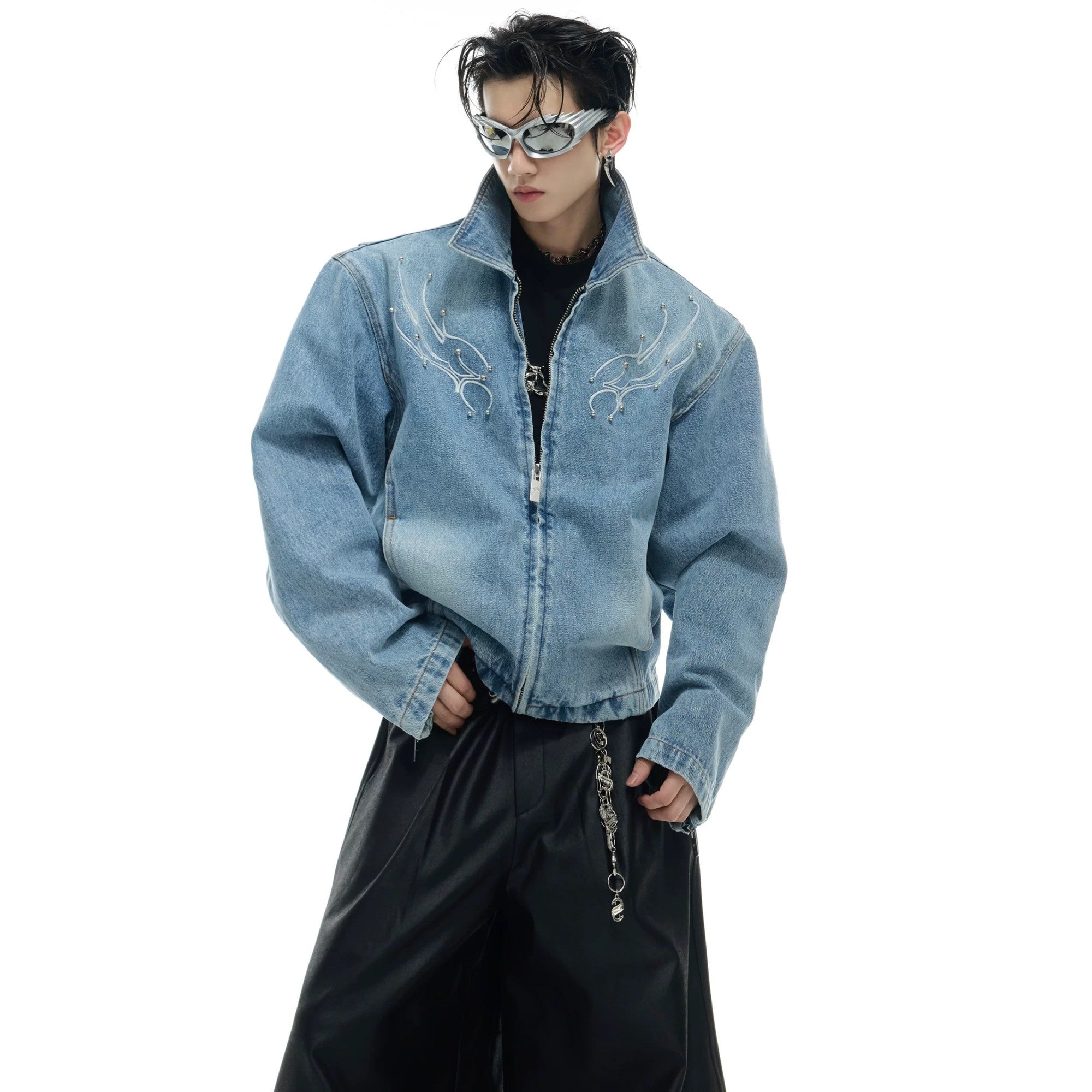 Back view of denim jacket showing 3D spine embroidery and studs