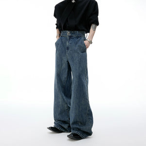 Front view of baggy washed wide-leg distressed denim jeans in blue