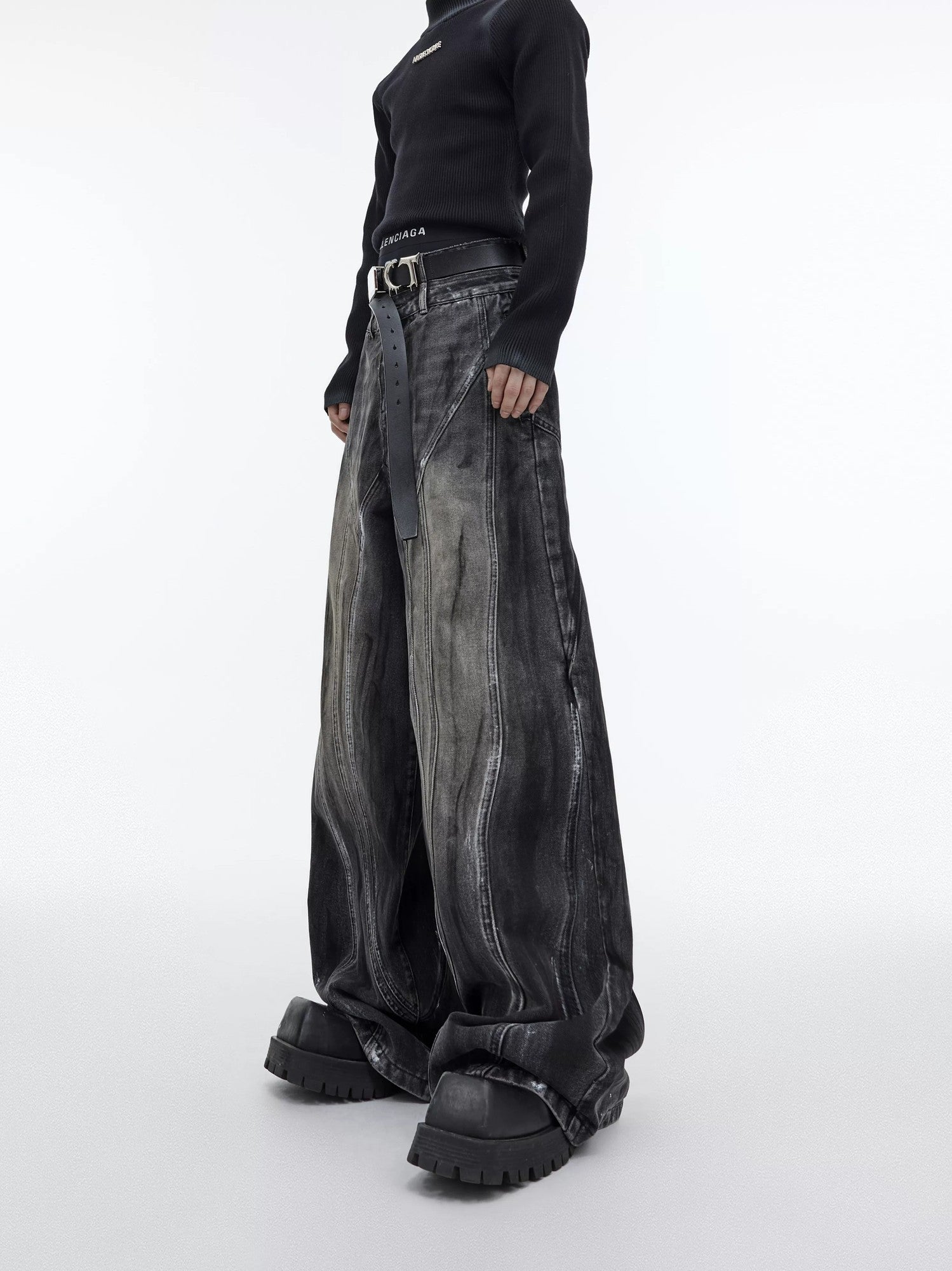 Front view of black distressed wide-leg jeans with splatter design