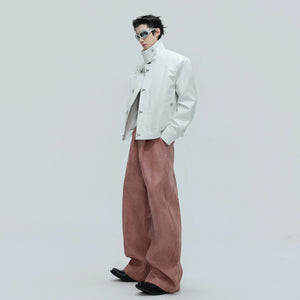 Detailed shot of high-quality metal buttons on ribbed pants