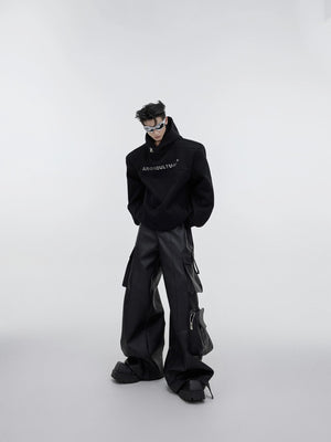 Styling wide-leg leather pants with chunky sneakers for streetwear look