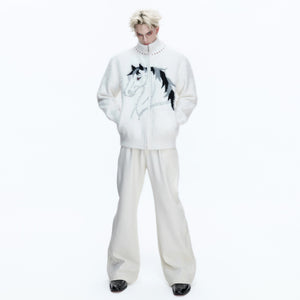 Model wearing oversized faux mink cardigan in an urban street setting