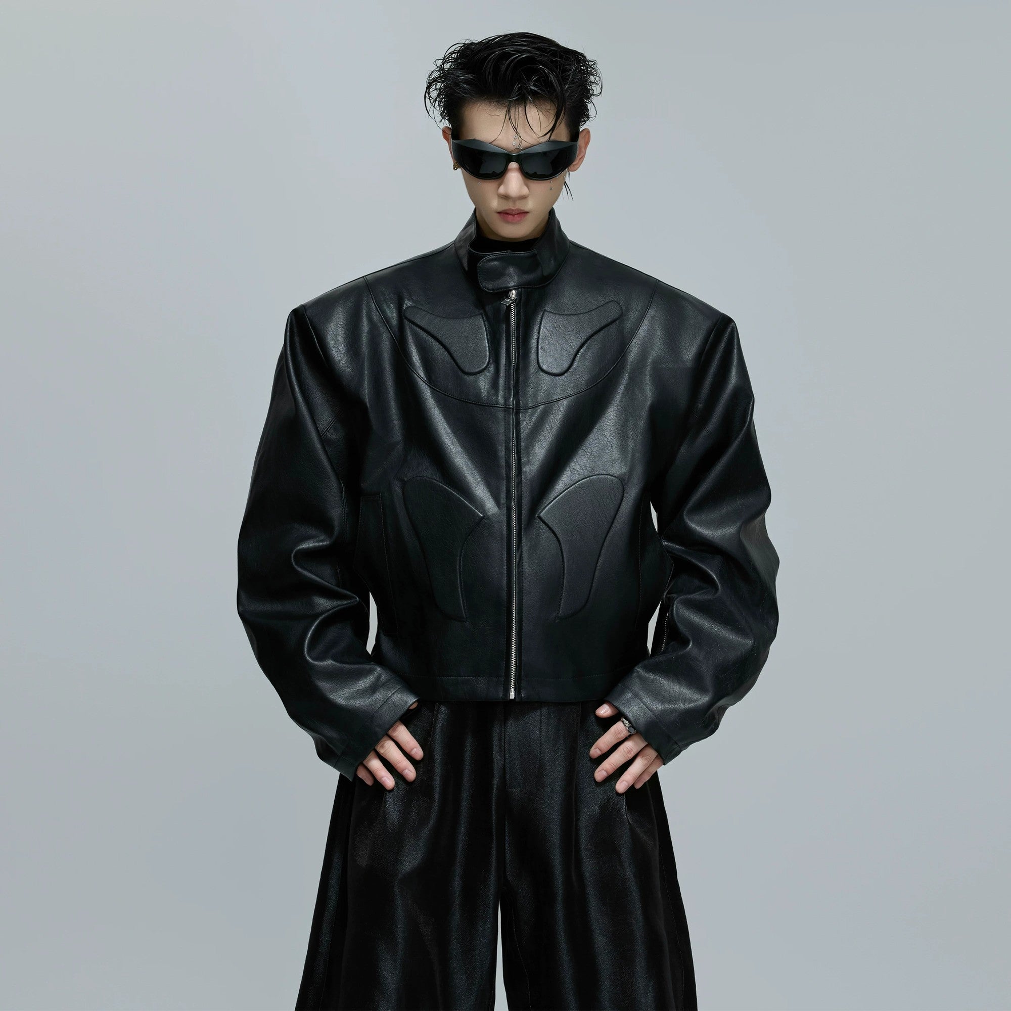 Front view of black 3D embossed deconstructed armor moto jacket