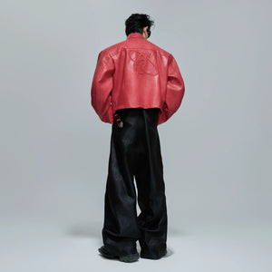 Model wearing oversized armor moto jacket in urban setting