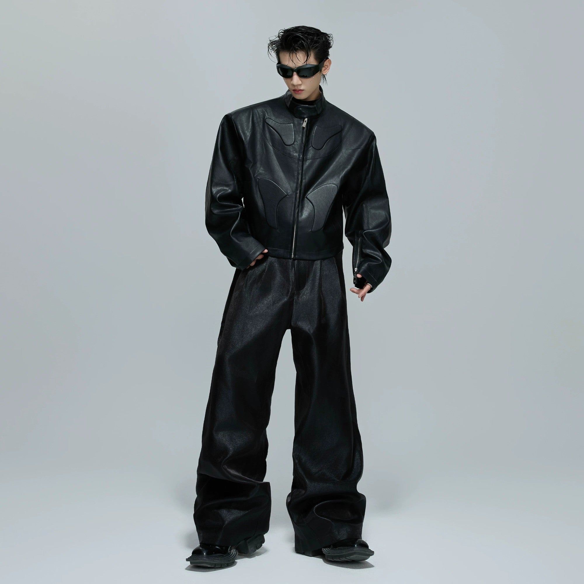 Back view showing structural silhouette of deconstructed jacket