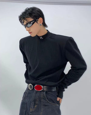 Close-up of mock neck design and structured padded shoulders