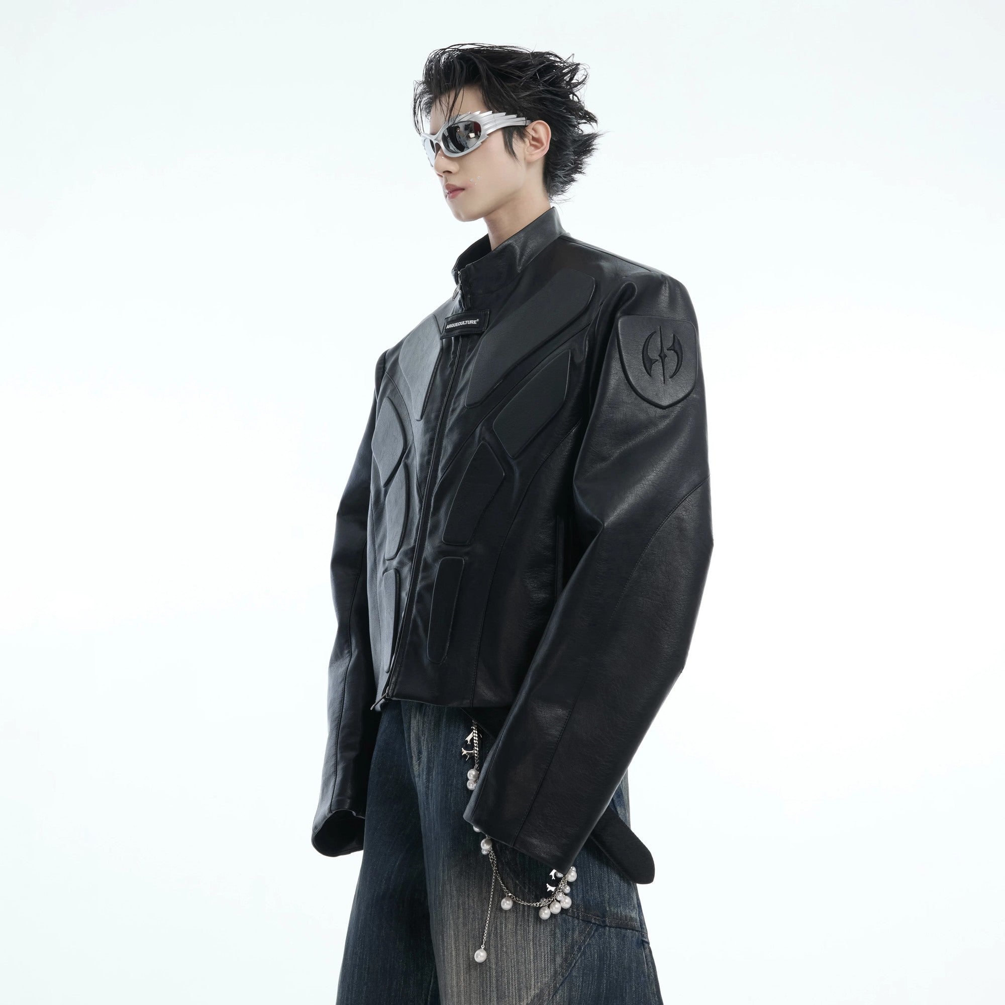 Black cyberpunk deconstructed moto jacket with 3D armor relief details