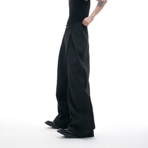 White 3D tailored wide-leg trousers with intricate embroidery details.