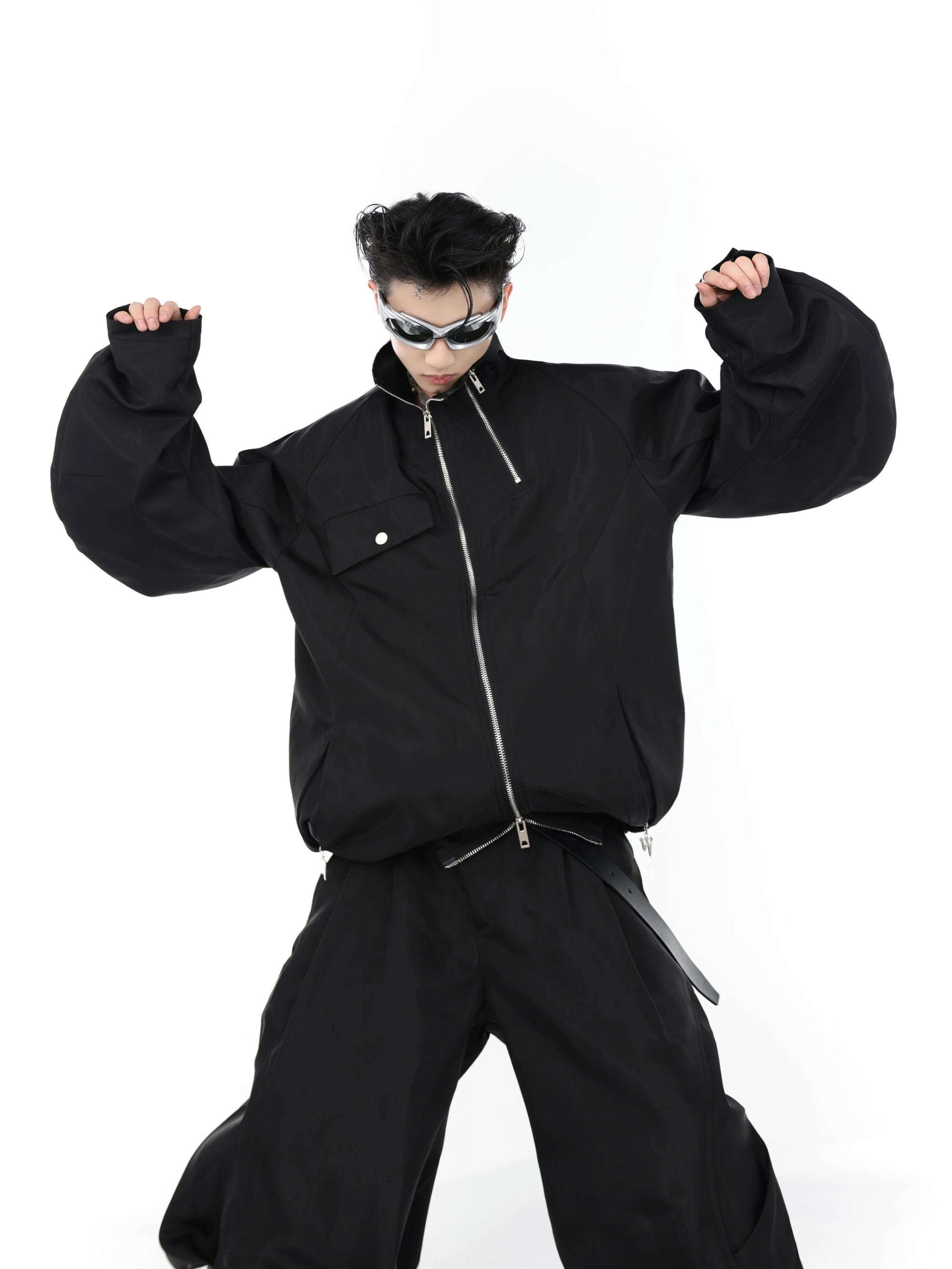 Full techwear set with pleated cargo pants and futuristic windbreaker.