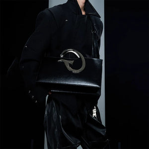 Close up of the irregular metal chain and pleated texture