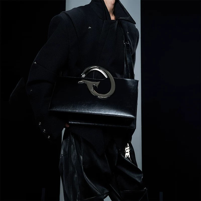 Close up of the irregular metal chain and pleated texture